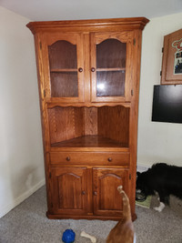 Solid wood corner cabinet.