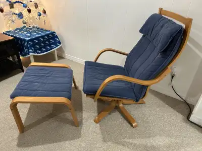 Vintage IKEA Poang chair and footstool that turns and tilts. Cosmetic damage 2 of the feet, but does...