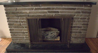 Tiled Brick Fireplace with Sliding Screen and Log Display