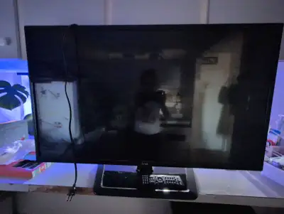 This is an LG TV in used condition. I'm not sure of the exact size, but it looks like a 32 inch. The...