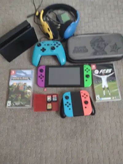 Nintendo switch with headset pro controller 5 games and micro sd, View more