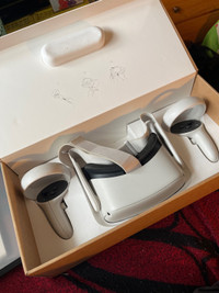Occulus Quest 2 (comes with charger and box(