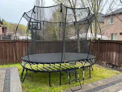 *Amazing Condition* Springfree trampoline that is 8x11 oval. Additional BRAND NEW net and extra rods...