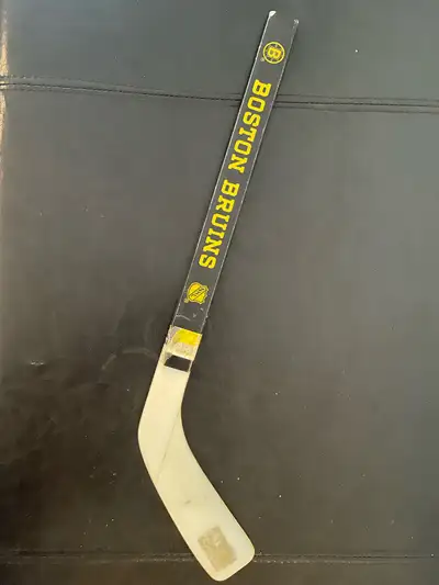 This is a vintage Koho Boston Bruins hockey stick, perfect for collectors or fans! It shows signs of...