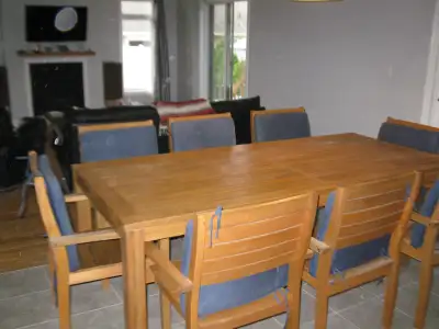 Table and chairs have never been outdoors. Great for large families or patio gatherings Teak-like wo...