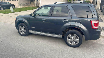 Ford Escape as si 240k , runs good, some rust on rear wheel well