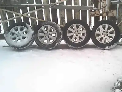 2010 Toyota Custom 4 Rims and 2 new All weather tires (5x 114.3) used on lots of vehicles 2 tires ar...