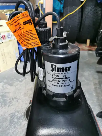 This is a Simer 2305-03 submersible utility pump, operating at 1/6 HP, 115V, and 60Hz, perfect for v...