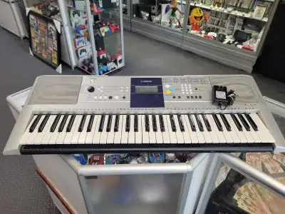 Yamaha PSR-E323 61 Key Keyboard w/adapter, View more