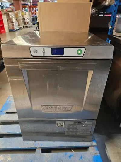 This is a Hobart dish washer, perfect for commercial use, offering robust performance. It's in used...
