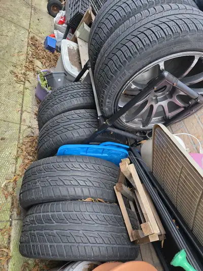 A set of winter tires on rims and 2 spare tires on trims