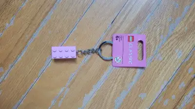 Add a touch of playfulness to your keys with this Lego Keychain, featuring a classic Lego brick in a...