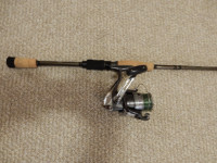 Fishing rod and reel plus loaded tackle box.