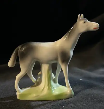 This vintage porcelain horse figurine doubles as a toothpick holder and is a charming addition to an...