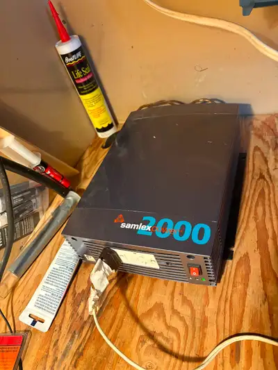 The 2000 W Samlex power inverter. 4–85 W solar panels. 30 amp charge controller. Still using them bu...