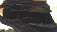 Black sheepskin winter coat new. Medium to large size.