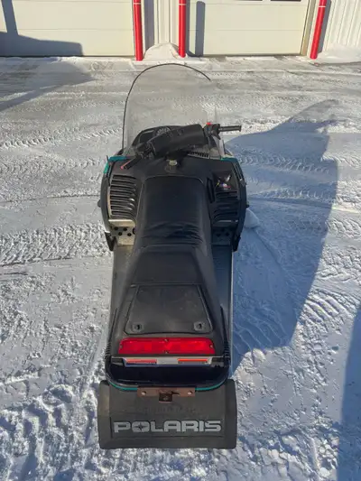 94 Polaris Indy Trail Lightweight, fan cooled. New windshield New Belt + a spare Added heated helmet...