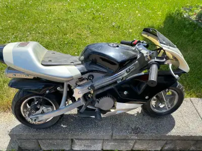 WON THIS POCKET BIKE AT THE CNE 20. SOMETHING YEARS AGO AND PUT IT ON A SHELF IN THE MAN CAVE. ITS N...