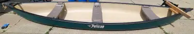 16 ft pelican canoe. Plastic. Comes with the seats and paddles in the photo
