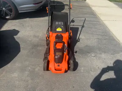 Cordless Electric Black and Decker lawnmower and trimmer, View more