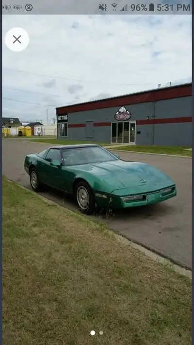 Get ready to turn heads with this classic green Chevrolet Corvette featuring iconic pop-up headlight...
