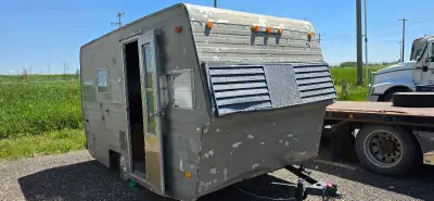 Gutted trailer finished with shag carpet and wooden platform with a really nice queen mattress and a...