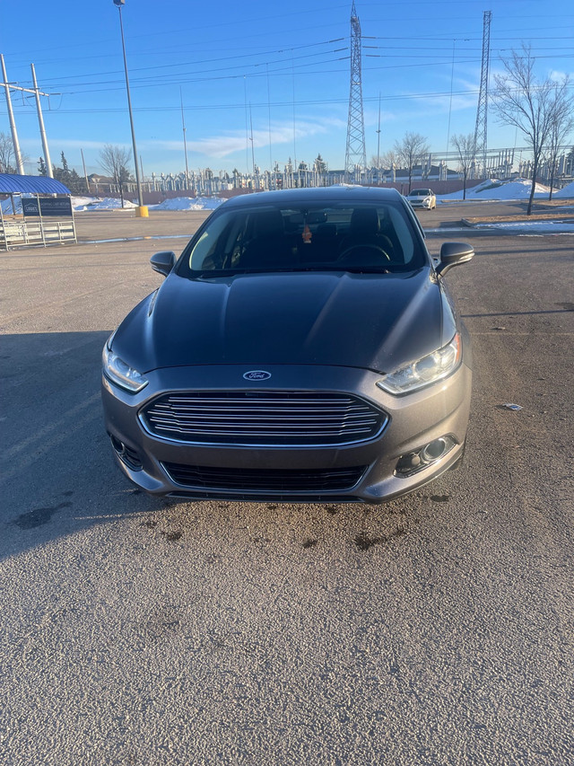 Check out this clean 2016 Ford Fusion Titanium active status tha in Cars & Trucks in Edmonton