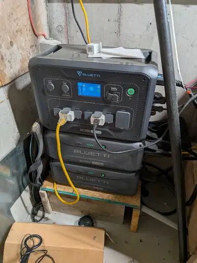 This is a used Bluetti AC300 power station with two B300 battery modules, offering a robust portable...