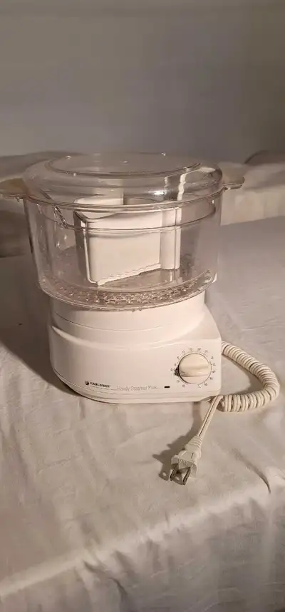 A Black & Decker Handy Steamer Plus (model HS90) is a versatile 2-tier electric food steamer and ric...