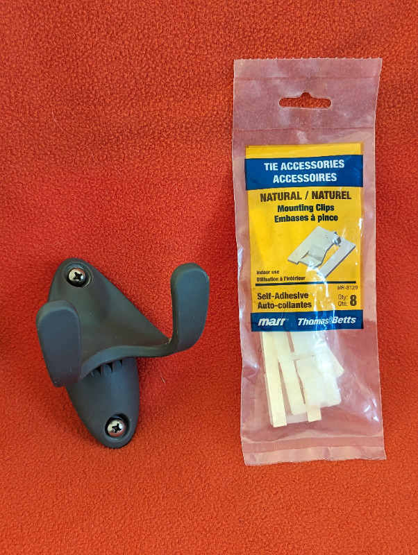 Two-armed wall hook and a package of mounting clips in Other in Edmonton