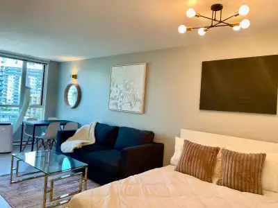 This spacious, open-concept FURNISHED residential studio suite is 409 square feet and includes a que...