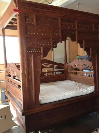 This is a stunning 100-year-old antique day bed, originally imported from Indonesia in 1997. It is m...