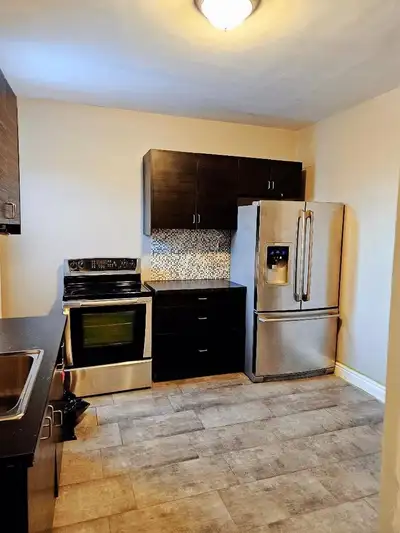 Renovated, Spacious 2 Bedroom + Den in a Charming Duplex