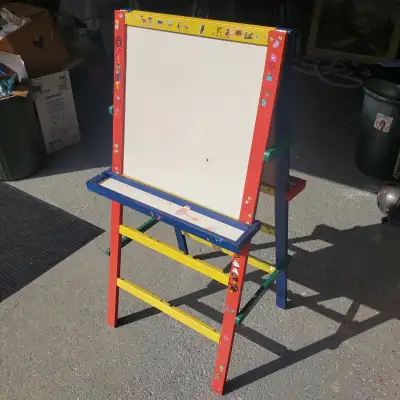 Well loved art easel for kids with chalk board on one side and white board on the other. Was probabl...