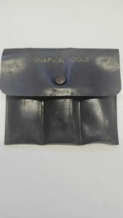 This is a Snap-on Tools set, including various wrenches and tools, all neatly organized in a compact...