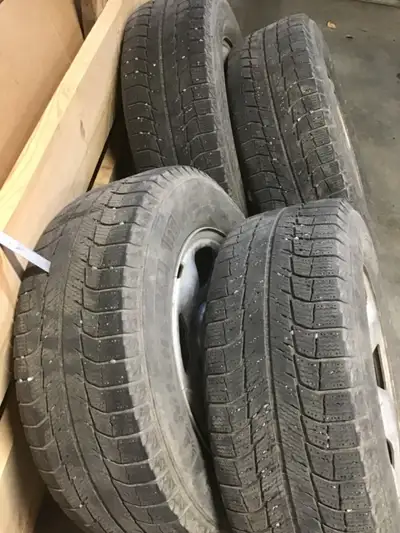 Winter tires, rims with tire pressure sensors, lots of wear left. $400 obo.