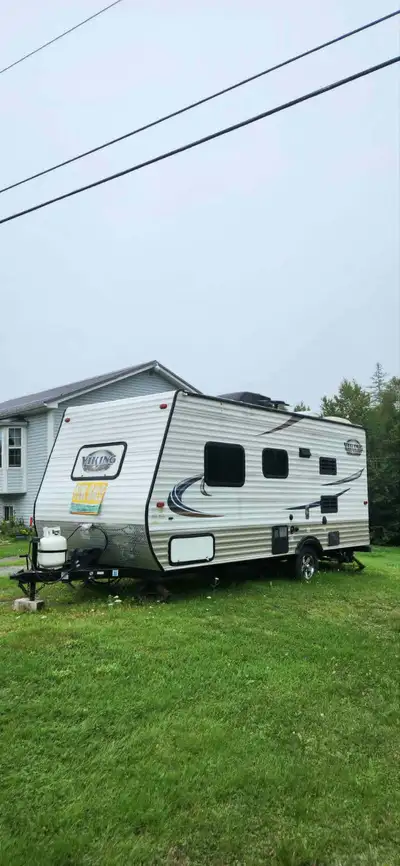 Perfect couples trailer. Comes with a brand new mattress, 2 new pillows and grandma's quilt. A table...