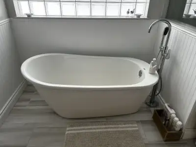This is a Maax Sax two-piece oval AcrylX applied acrylic freestanding bathtub, perfect for a luxurio...