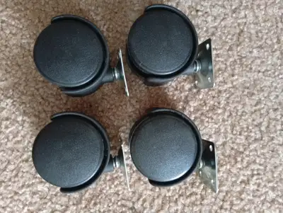 Set of 4 furniture caster wheels. Size: approx. 2” (5 cm diameter) Swivel wheels with metal mounting...