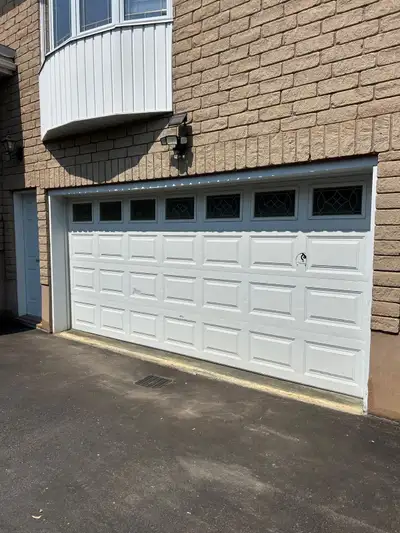 Great condition white garage door 15’x7’ with silent motor, View more