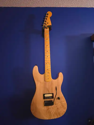 Solid 1 pc Ash body, Wilkinson hardware, strat style tremolo, magnetic control cavities. Neck is fro...