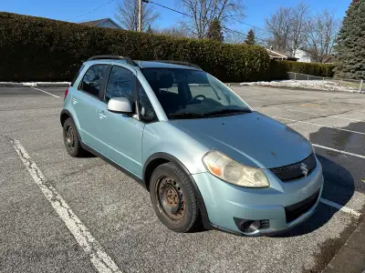 Suzuki SX4 2007 227 535 km Bonne petite auto awd Pneus été usure avancée montés sur mags Pneus hiver...