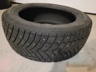 This is a 215/55R17 Ironman Polar Trax winter tire, complete with studs for enhanced grip in snowy a...