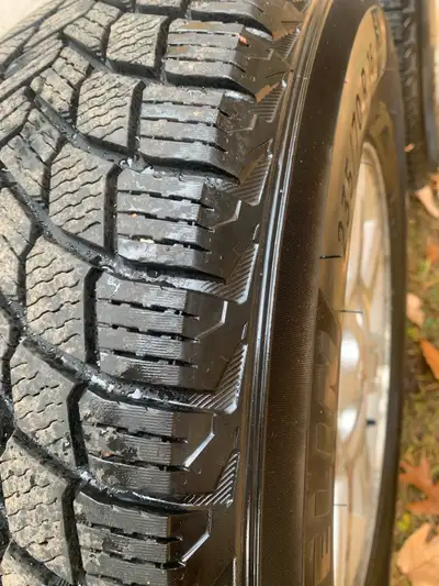 I'm selling a set of four Michelin winter tires, size 235/70R16, which are currently mounted on Mazd...