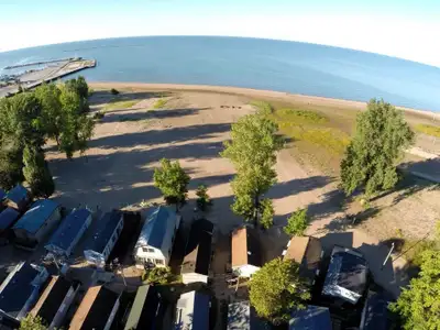 Lakefront cottage for sale on the beautiful shores of Lake Erie. Cottage is located inside a private...