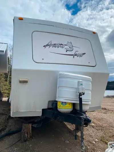 Arctic fox trailer with winter kit, slide out frontroom with extra bed in couch. Walk around queen b...
