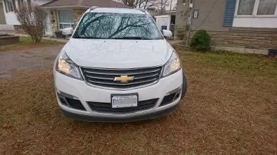 THE 2017 CHEVROLET TRAVERSE LT IN THE STRIKING WHITE TINTCOAT COMMANDS ATTENTION WITH ITS BOLD AND C...