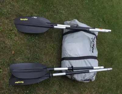 Sevlor 2 person inflatable Kayak with 2 double paddles. Used only once Like new condition
