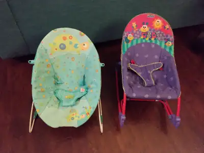 Two baby bouncers with vibration (light blue and royal blue) Royal blue with canopy shade Both in pe...