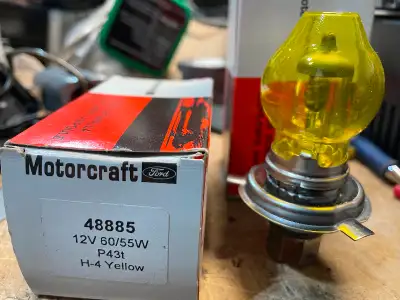 Pair of Motorcraft H4 , European standard (yellow) automobile bulbs . Used very little (were on a sh...